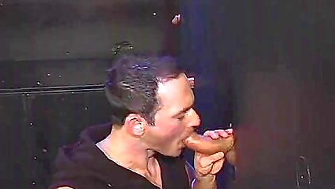 Gloryhole performer is blowing two hard dicks and is getting fucked