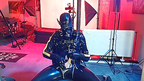 Boy does latex fetishism of the girl with rubber cock