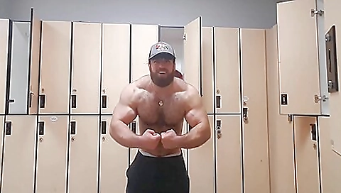 A hot muscular bear in a sexy red dress is in the middle of a dance