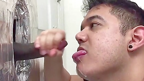 Black pornstar with a long black cock fucked in the gloryhole