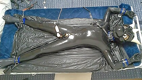A hot rubber dragon is rubbing his body with latex dildo