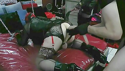 Gaping doll is in the middle of bondage domination