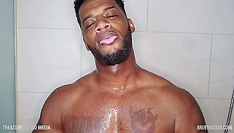 Big-busted white guy is in the shower with a tattoo